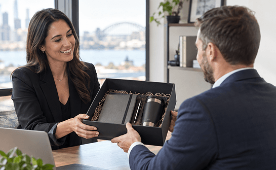 Professional coworkers exchanging a handshake in a modern corporate office setting